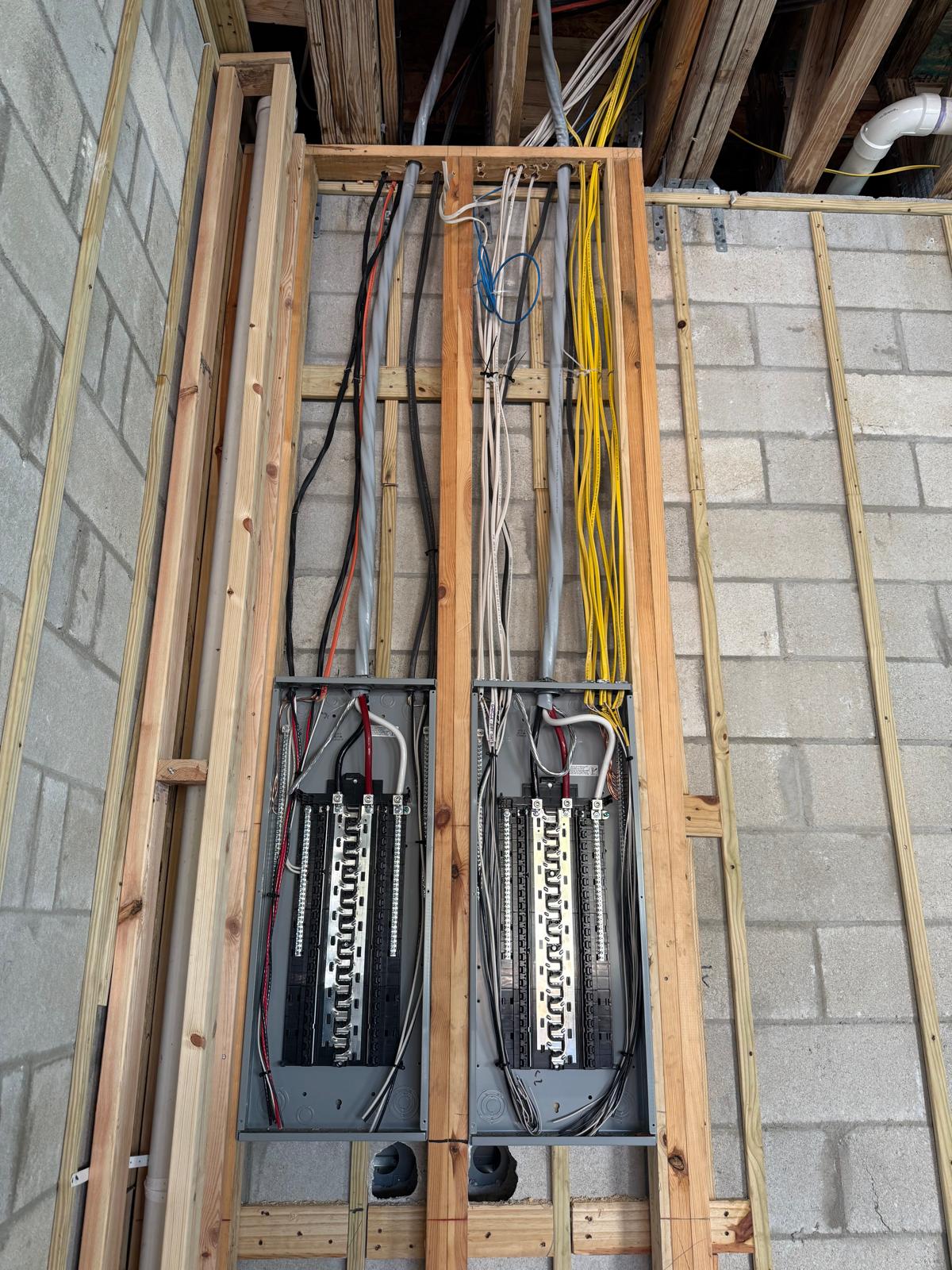 Dual electrical panel installation in new construction framing